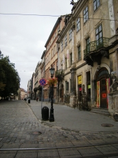 powiększ